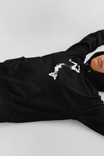 Load image into Gallery viewer, laying in gray background girl wearing goth black pullover with vintage victorian style girl split in two parts design in aesthetic style